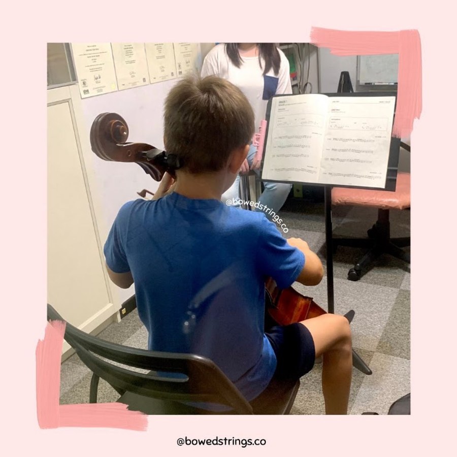 A young cello student in a lesson at Bowed Strings
