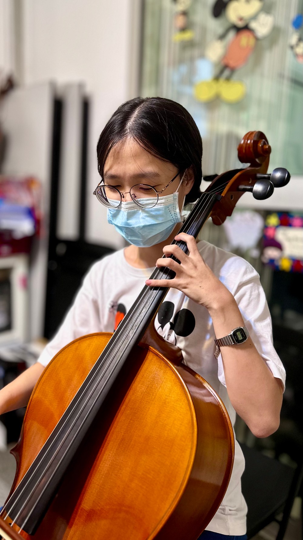 A cello student practising at the studio