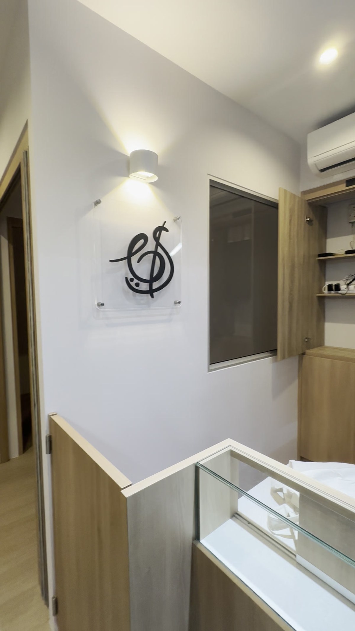 The Bowed Strings studio interior with the treble-clef mark